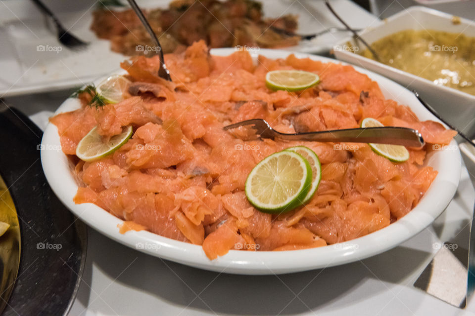 Marinated salmon on a christmas buffet. This is one of the dishes that are part of the traditional Swedish Christmas buffet.