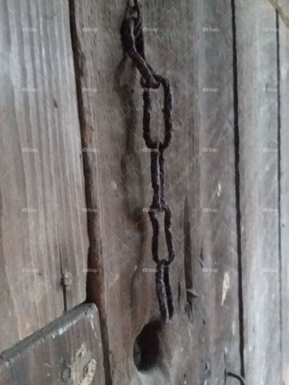 Rusting chain on door