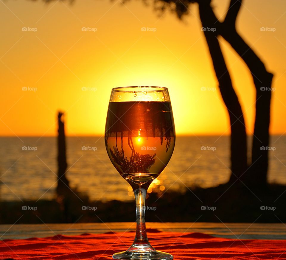 Wine and sunset at the beach
