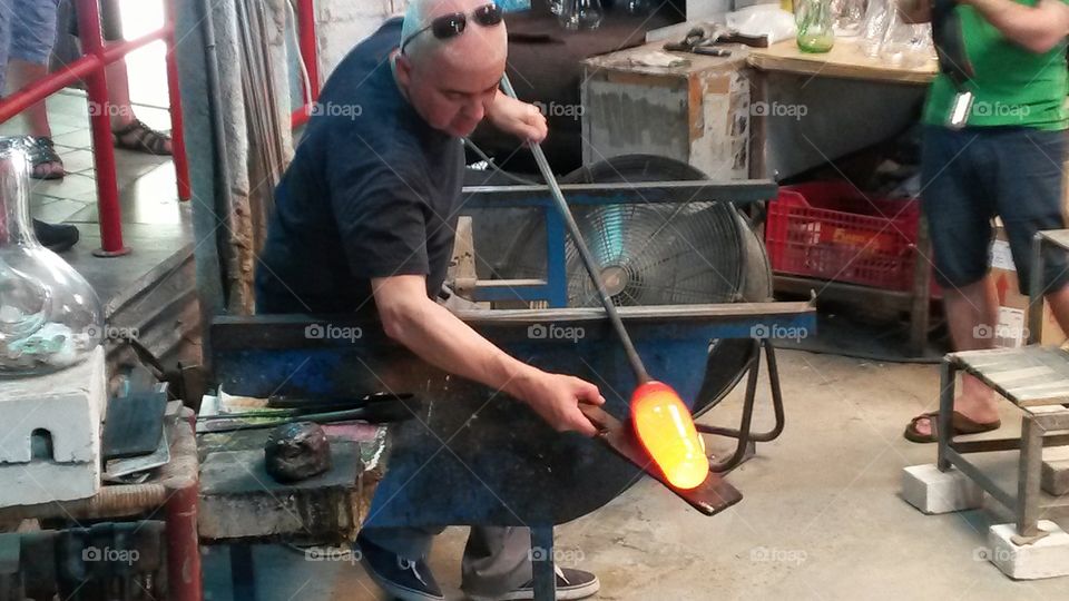 Glass master at work, Barcelona, Spain.