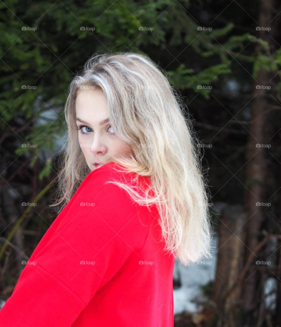 Pretty blue-eyed girl in red coat.