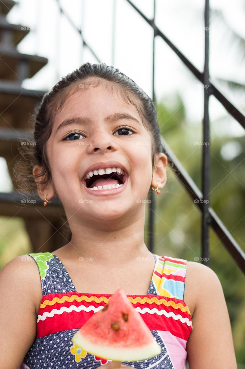 Sitting outside and enjoying the cool breeze.My little one's having fun.