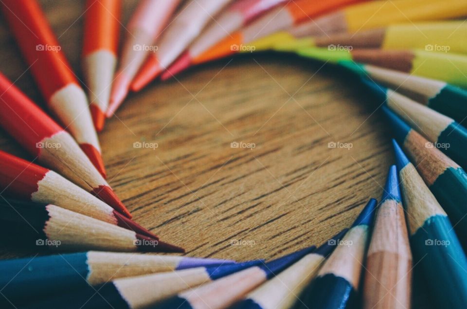 Circle of multi colored pencils
