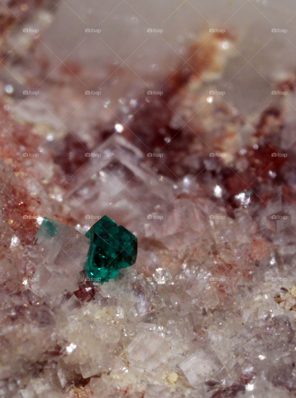 Tiny dioptase crystal on Quartz 