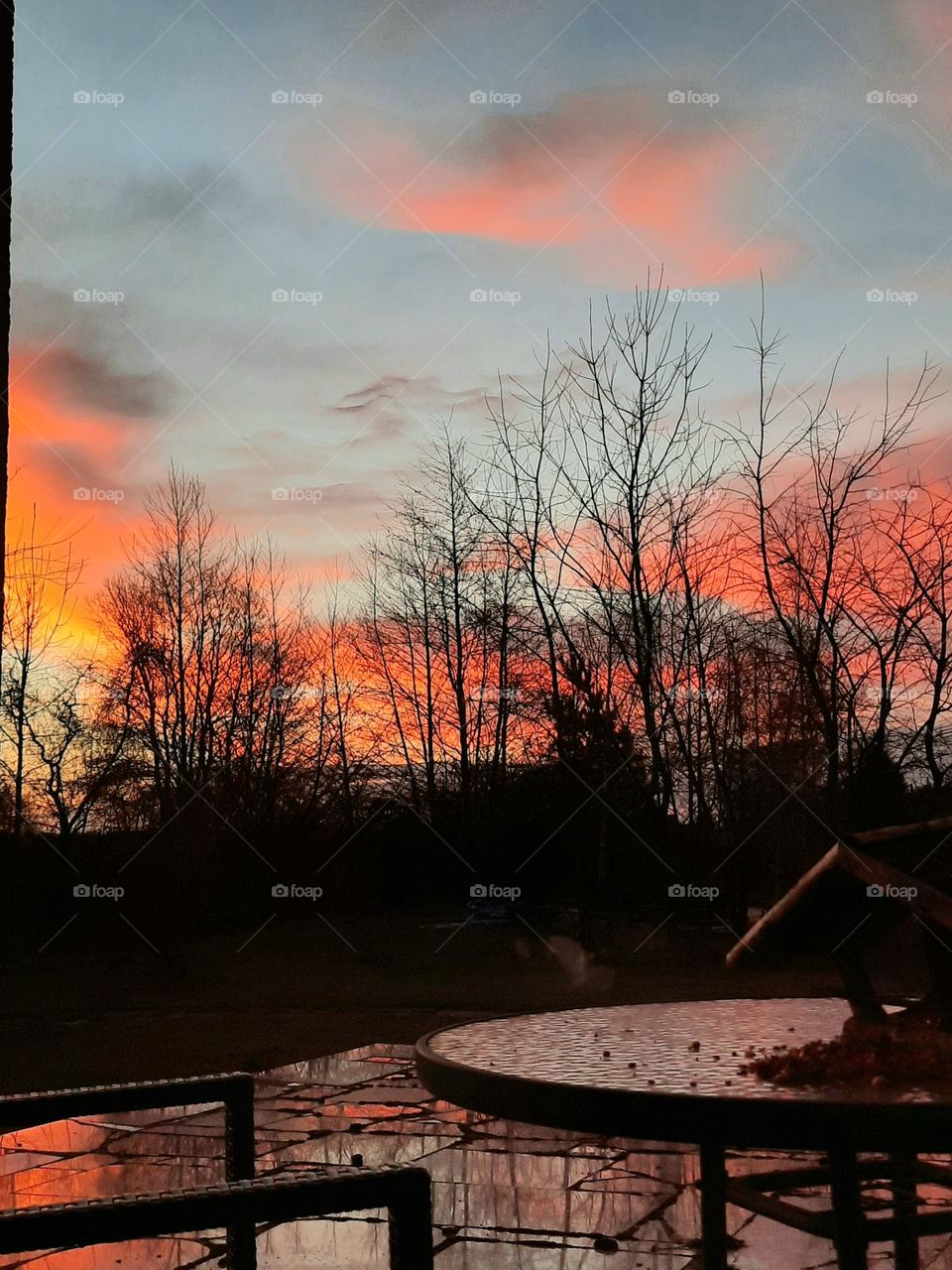 colours of sunrise reflected in stone terrace