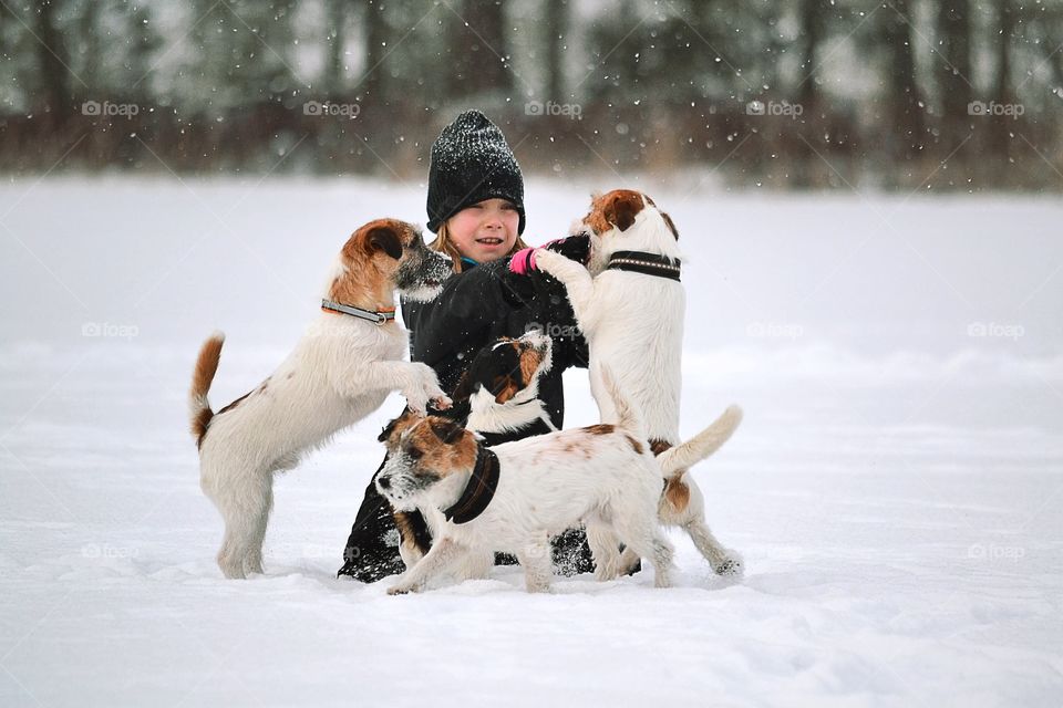 Girl playing with dog