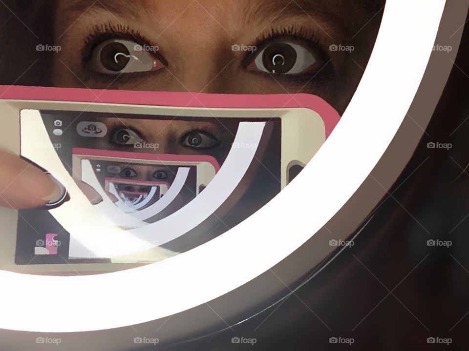 Infinity mirror photograph as seen through a cellphone camera.