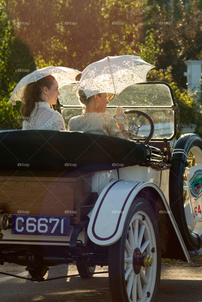 To Victorian ladies out for a Sunday drive in their antique car