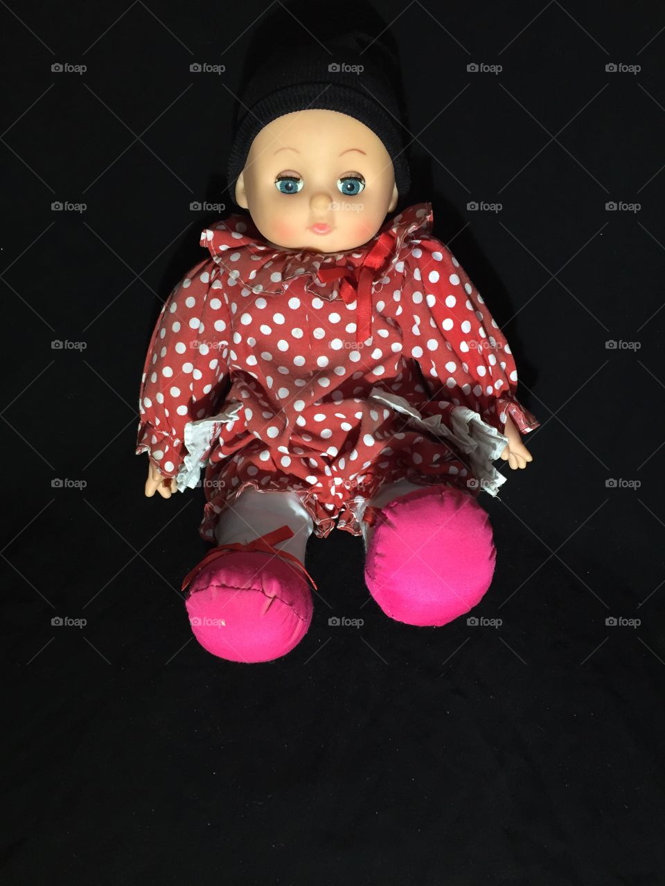 A doll toy isolated on black background 