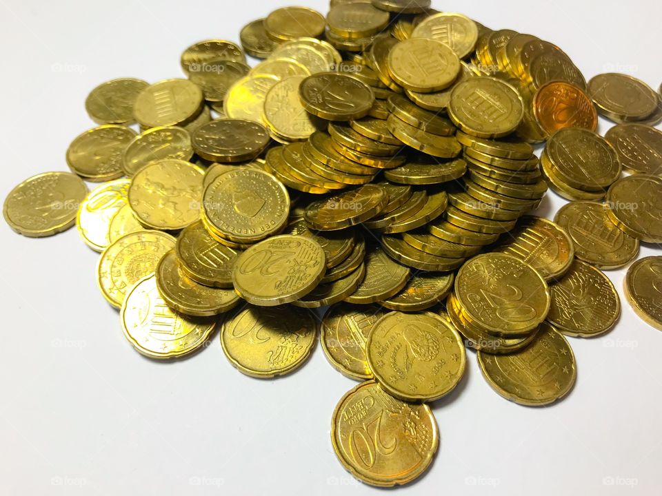 Pile of twenty euro cent coins 