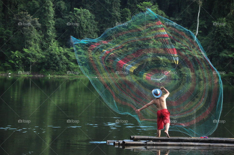 Fisherman trow the net