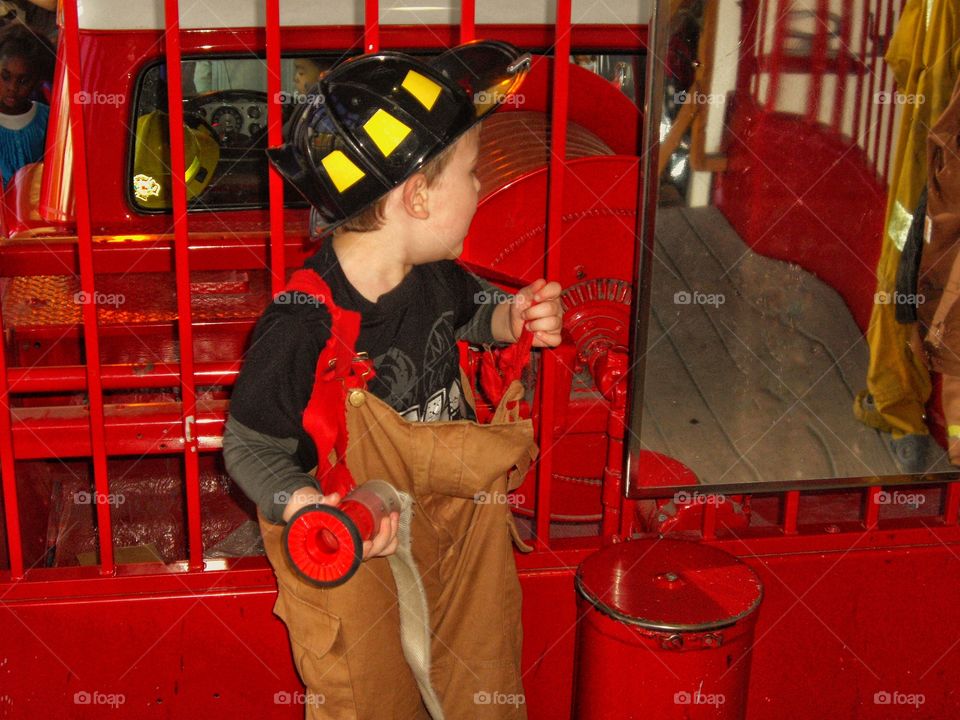 Boy In Fireman Costume
