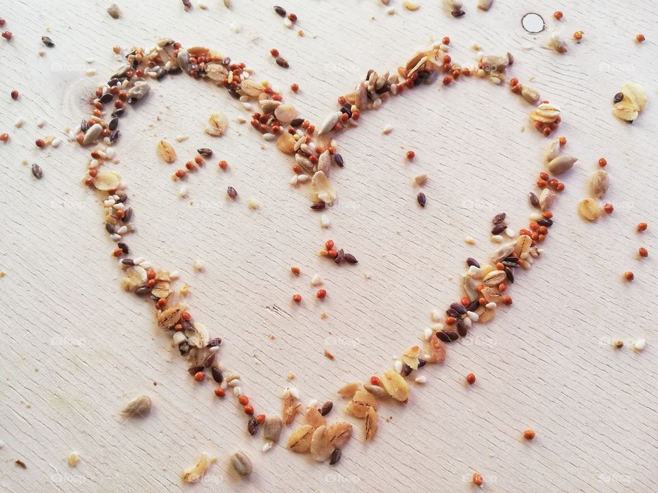 Mix of seeds and cereals form a heart