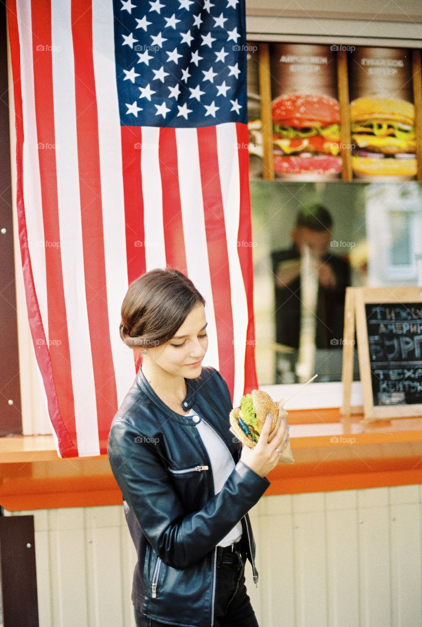 Girl with American burger 