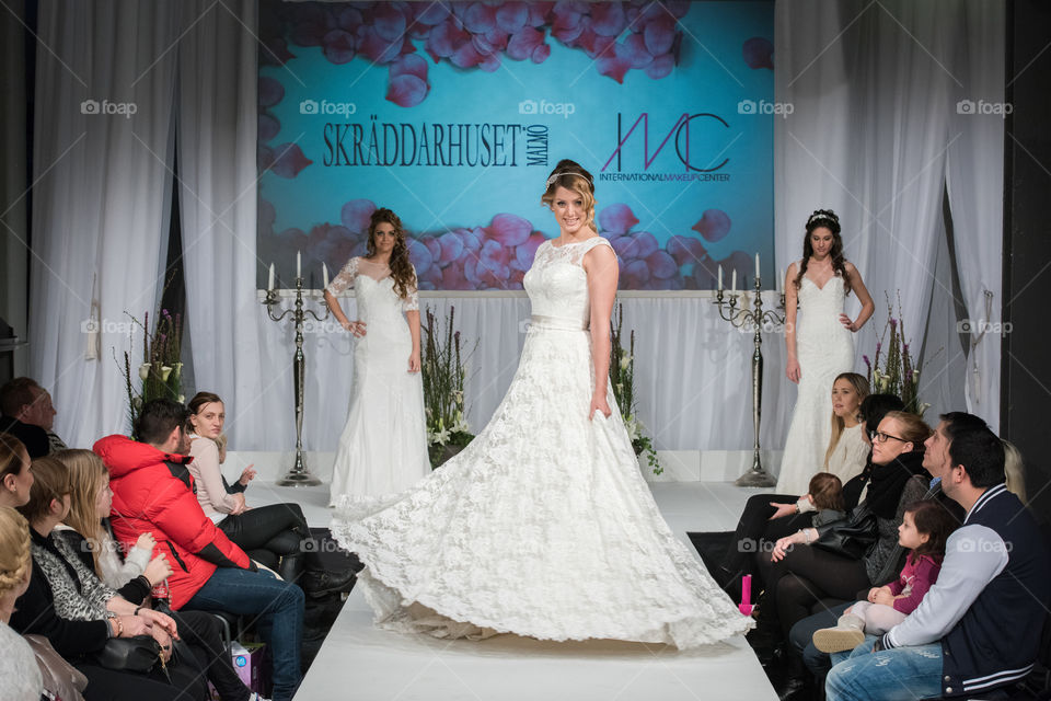 Fashion show at a wedding fair. Here are the latest dresses and clothes for both bride and groom.