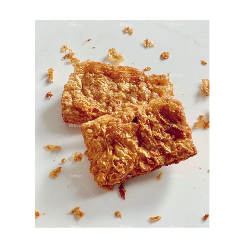 Vegetarian mock goose meat also known as soy crisps in golden hues 