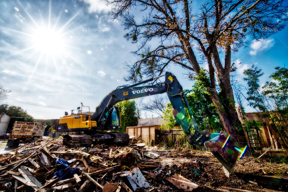 Volvo Equipment. Image of a Volvo deconstructing a house
