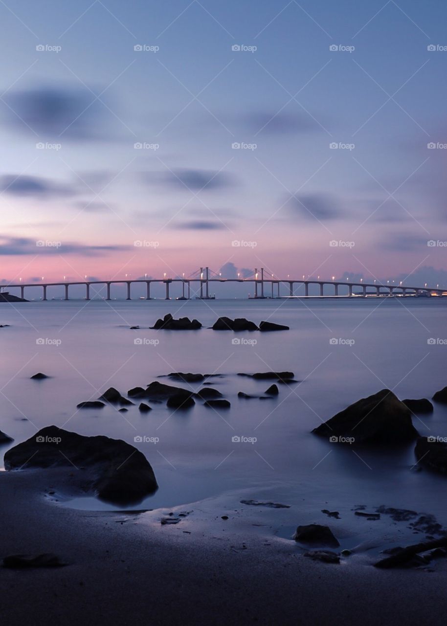 Break of Dawn at the city coastline,  through the Connection bridge.