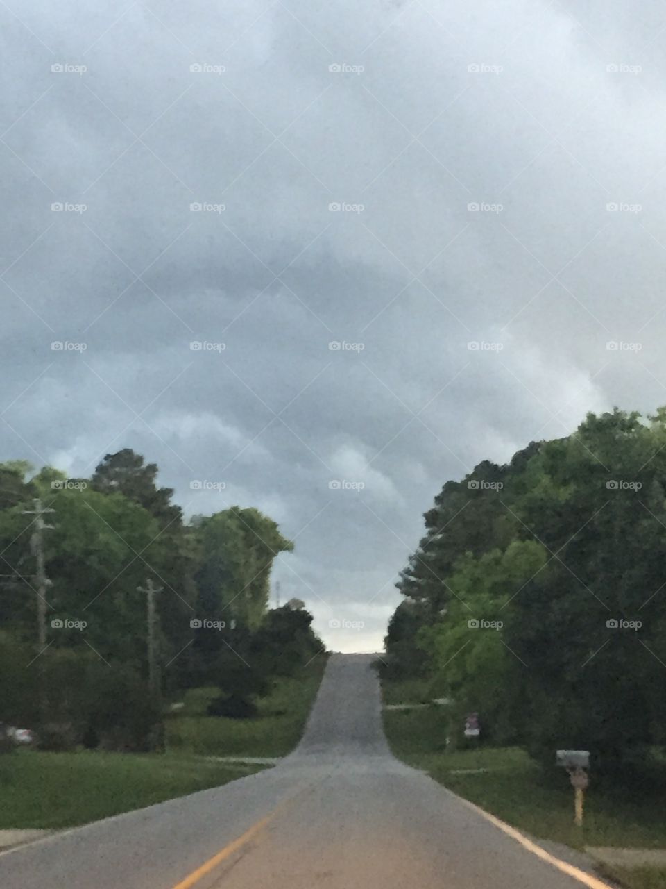 Storm a brewing . As you can see we were just riding down the road and into a storm.. But what beauty 