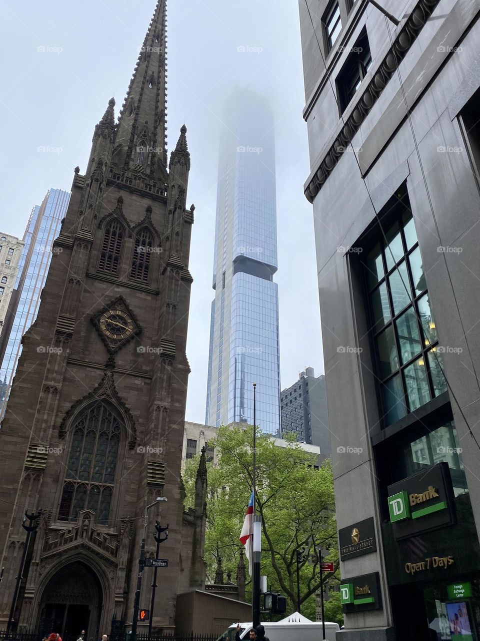 Trinity Church Wall St foggy morning, contrasting architecture 