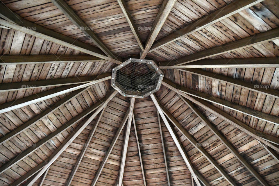 The ceiling of a gazebo becomes a maze of rectangular and octagonal shapes.