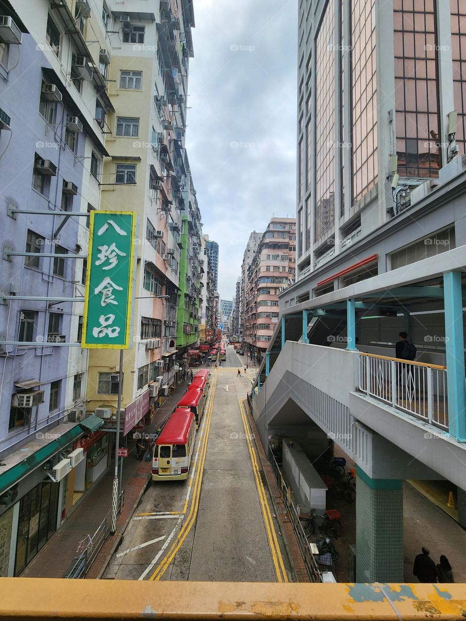 Red top mimi buses are parking along to serve the general public at the busiest traffic Mongkok area in Hong Kong