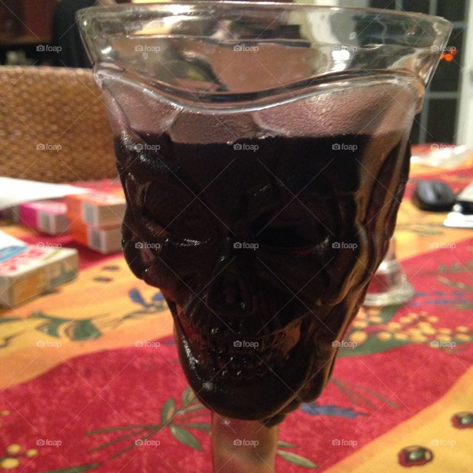 Wine in a skull plastic glass 