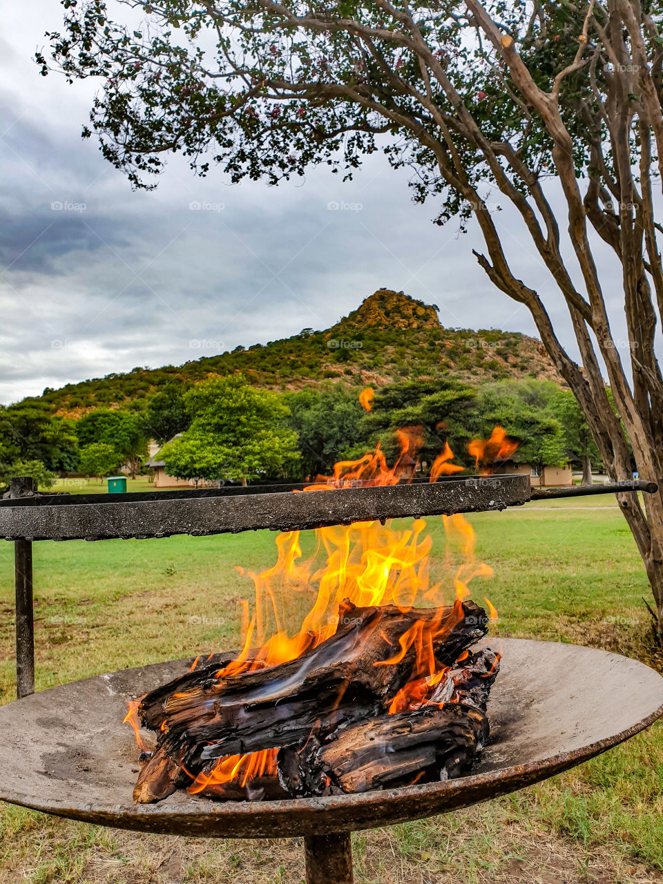 fire on a resort with mountain at the back