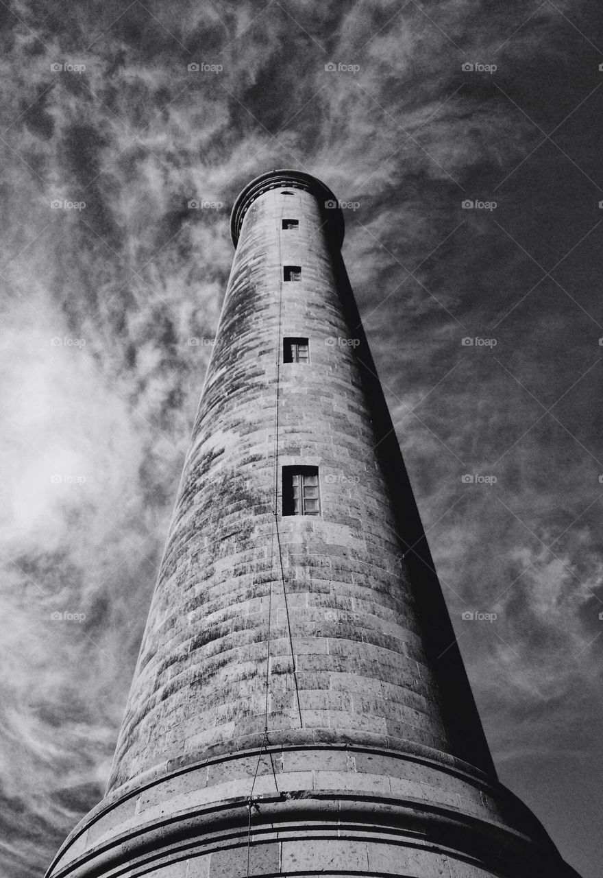 A lighthouse from low angle in black and white 