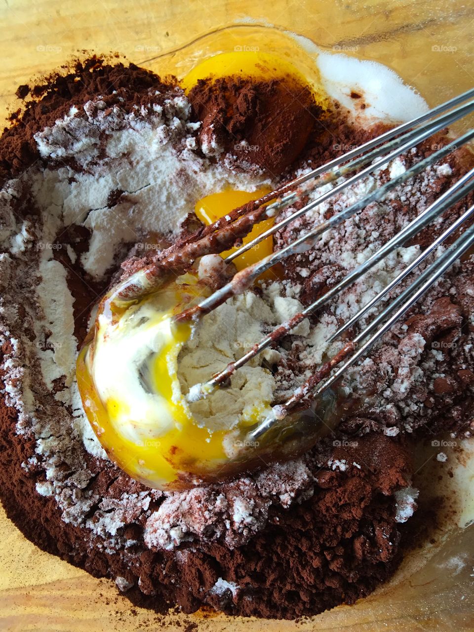 Whisking eggs into chocolate batter