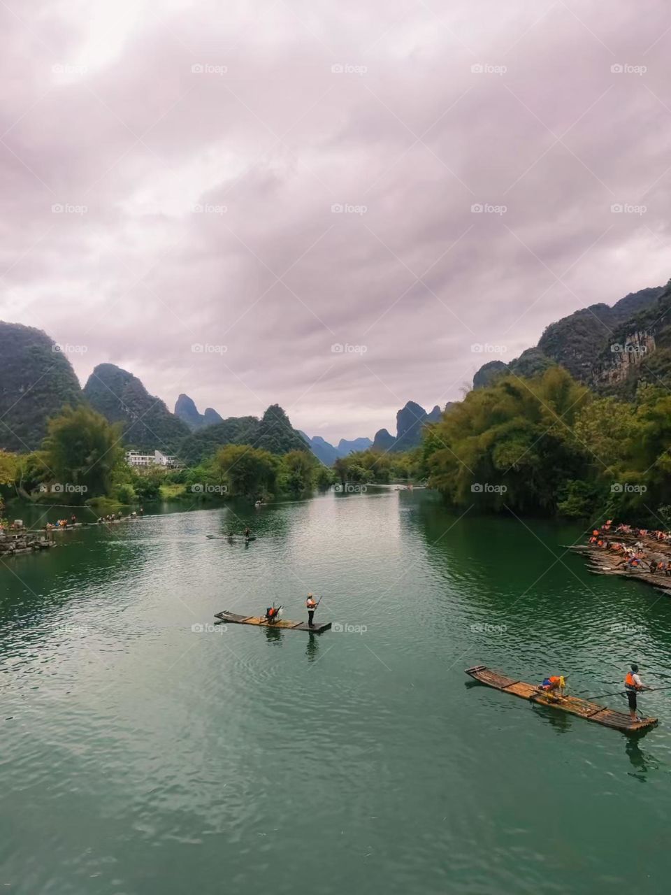 View of green mountains on the shore in Guilin,China.