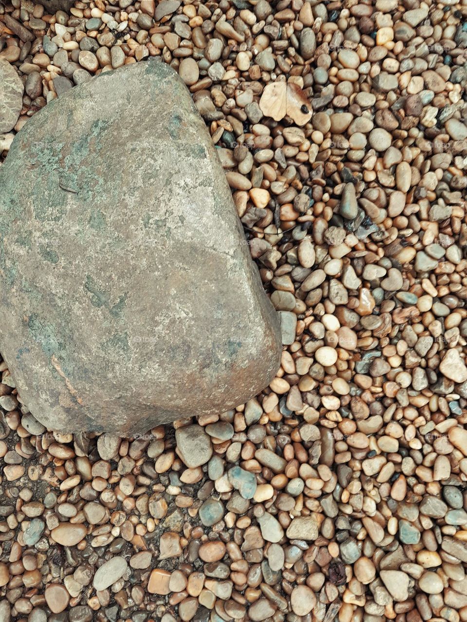 big rock and small rocks on The floor