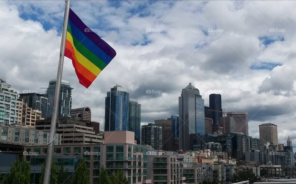 Gay pride flag and Seattle skyline