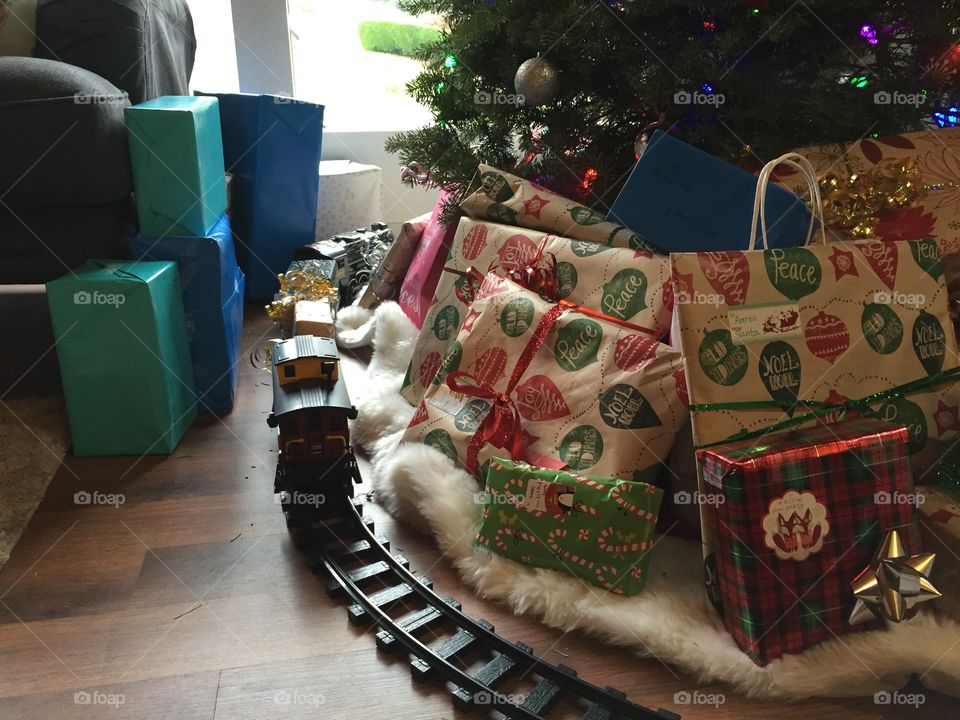 Christmas, Christmas tree, gifts, presents, boxes, train, train track, ribbons, gift wrap, wrapper, holiday, under the tree