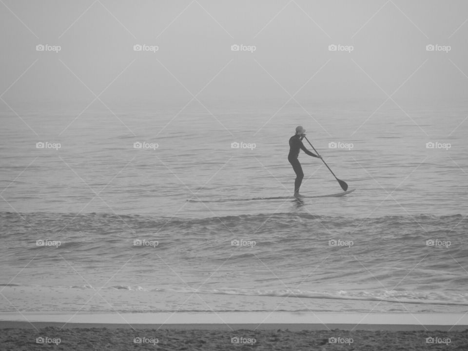 SUP? What's up with you? Stand up paddleboarder at Wrightsville Beach.