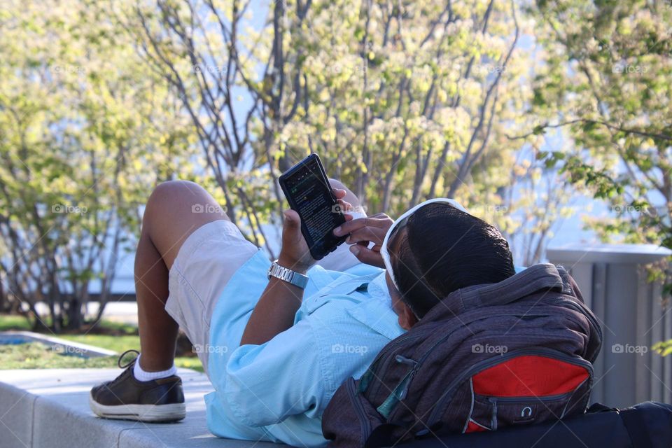 Man is browsing something on his phone