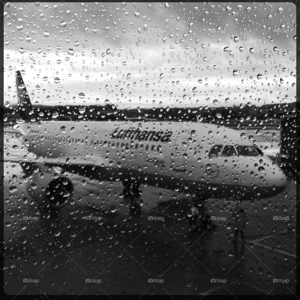 Plane through rainy window