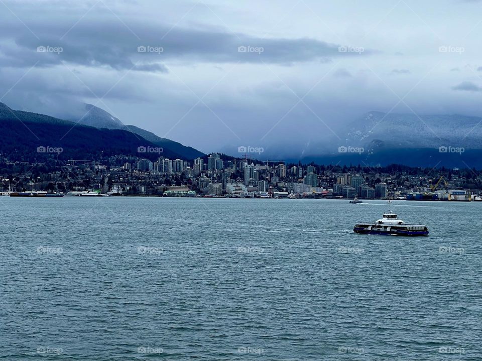 View of North Vancouver from across the Vancouver Harbour in Vancouver British Columbia 