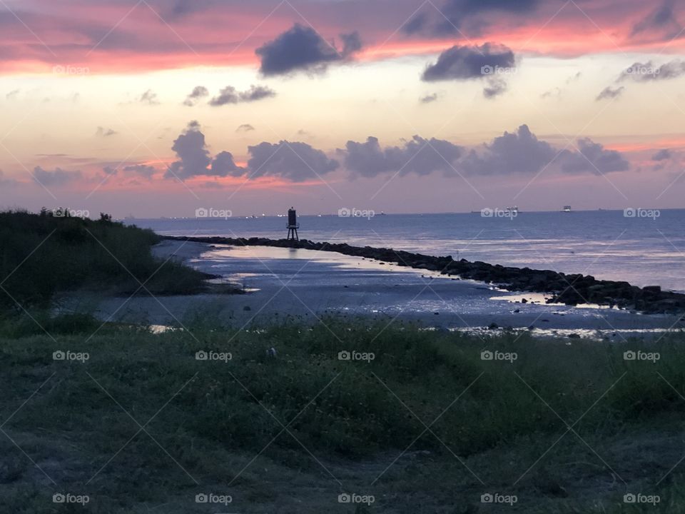 Sunset over the East end of Galveston, Texas
