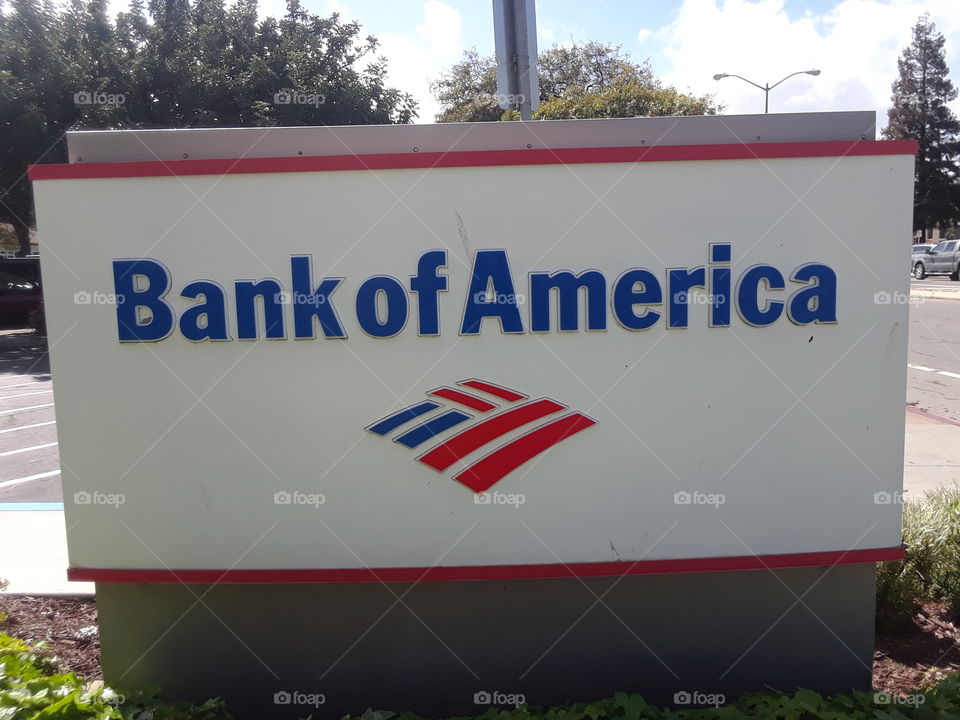 Bank of America sign.next to my work.nice colors.red and blue.outdoor sky.day time living.thought I should take a picture of this.