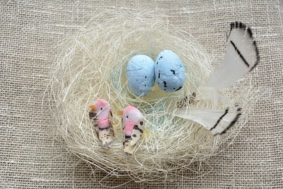 Easter spring holiday decorative birds with eggs in nest