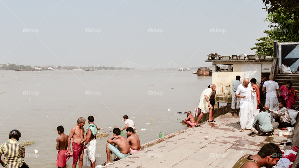 Kolkata, West Bengal, India 15 October, 2018 - View of The heritage Prinsep Ghats along bank of the Hooghly River. People gathered in Mahalaya hours just before Durga Puja festival to take a holi bath