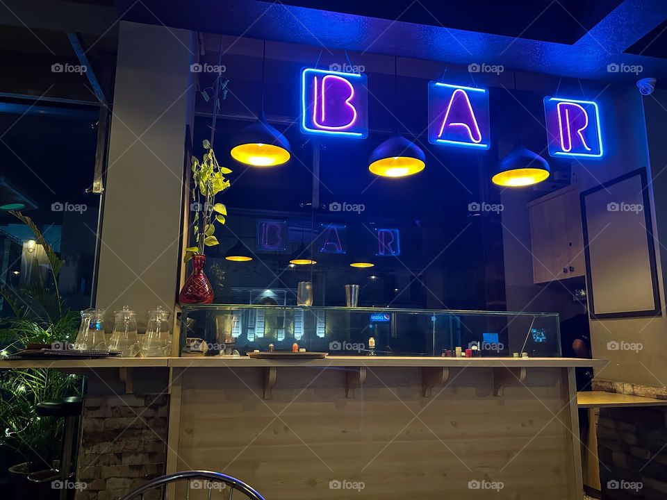 BAR illuminated in neon lights