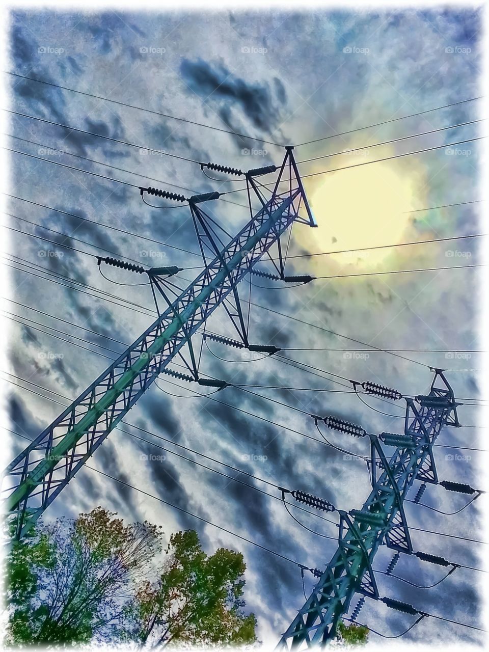 Power Line Towers. Power line towers on a partly cloudy day.