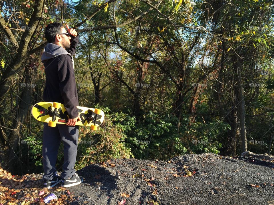Look out . Skater looking at the top of a forest from a cliff, Easton PA
