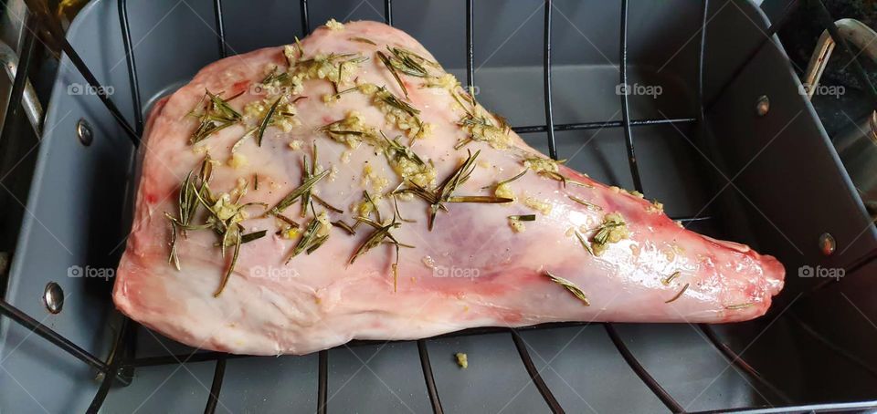 Leg of Lamb about to go in the oven with rosemary and garlic