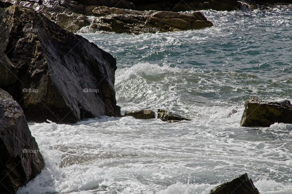 waves breaking on rocks