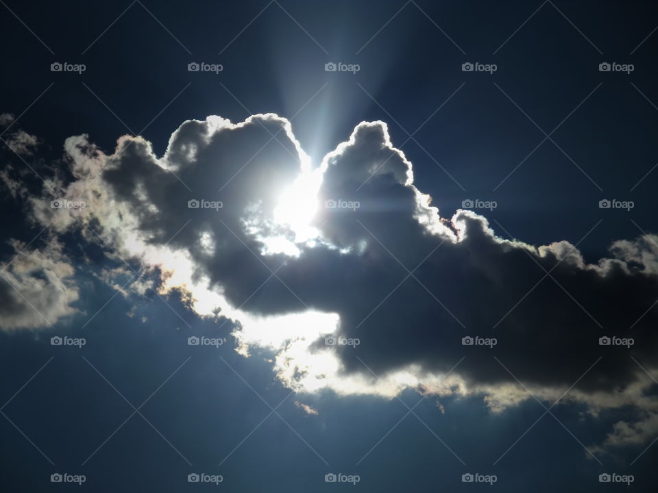 breaking through. This is a picture of the sun coming up through the clouds. 👣 🚶 🏃 🔥 💨