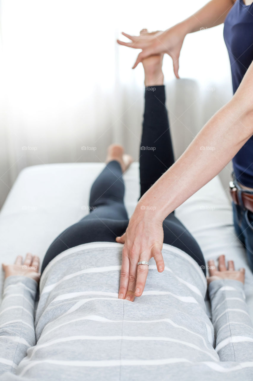 Massage therapist giving a treatment. 