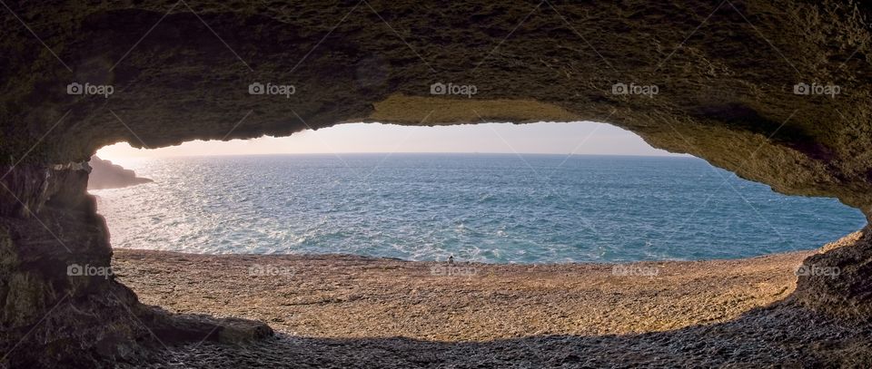Natural cave in front of the ocean